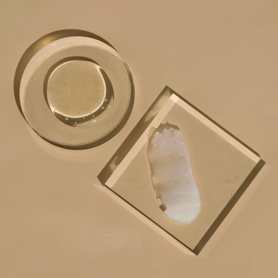 Recover Thickening Shampoo for Men and Recover Thickening Conditioner product dispensed onto glass to show product texture